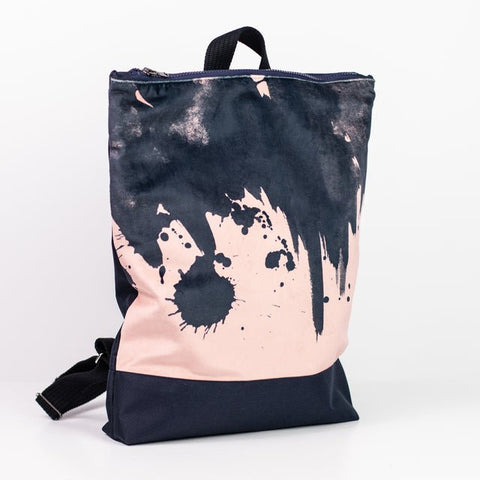 4. Side view of Muni Watercolor backpack in pink with adjustable straps