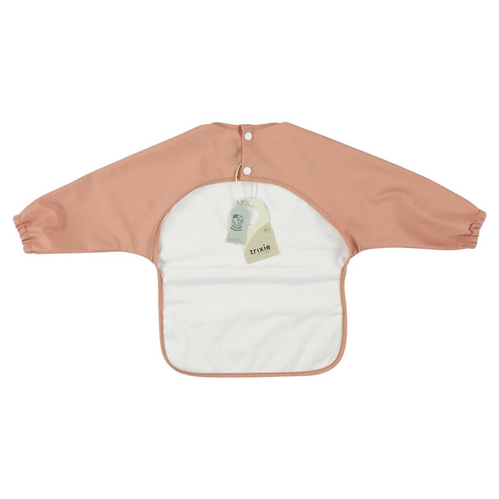 3. Back view of pink waterproof long sleeve bib with white lining and tags, shown on white background