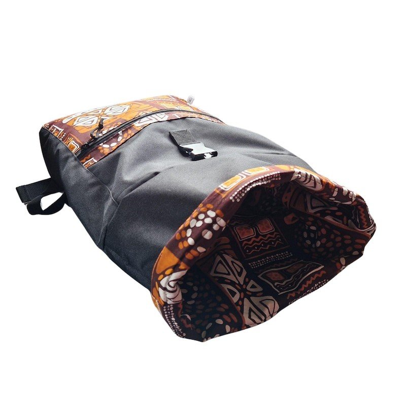 3. Close-up of Drinbags backpack showing orange patterned interior and rolltop closure