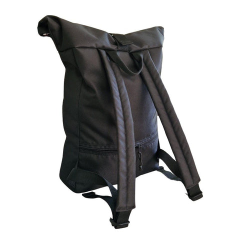 2. Back view of Drinbags waterproof rolltop backpack in black with padded straps, studio setting