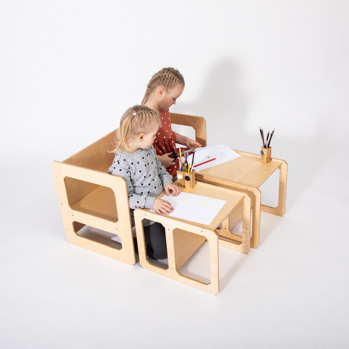 2. Two children drawing at natural wood Montessori weaning table and chair set on white background