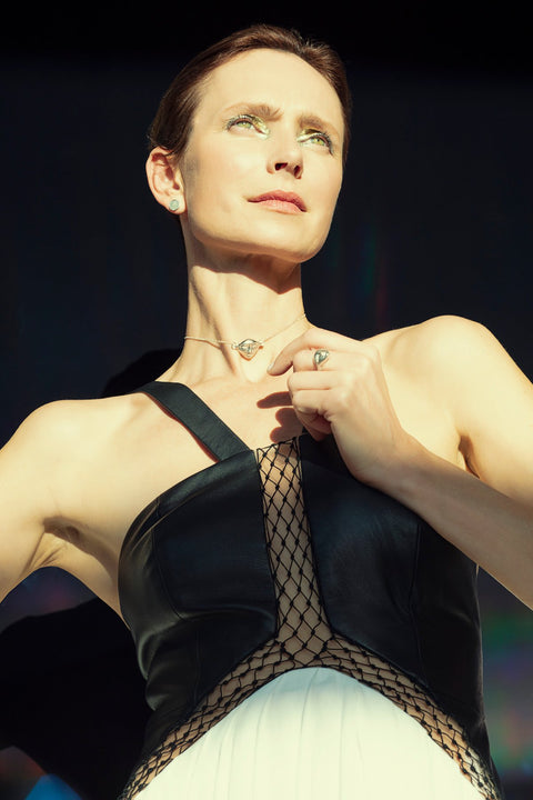 1. Woman wearing Hathor Harmony Ring in silver by New Vintage by Kriss, shown in lifestyle setting