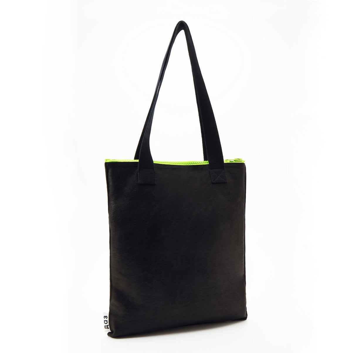 2. Studio shot of Daz Studio black leather tote with neon green zipper and black nylon strap
