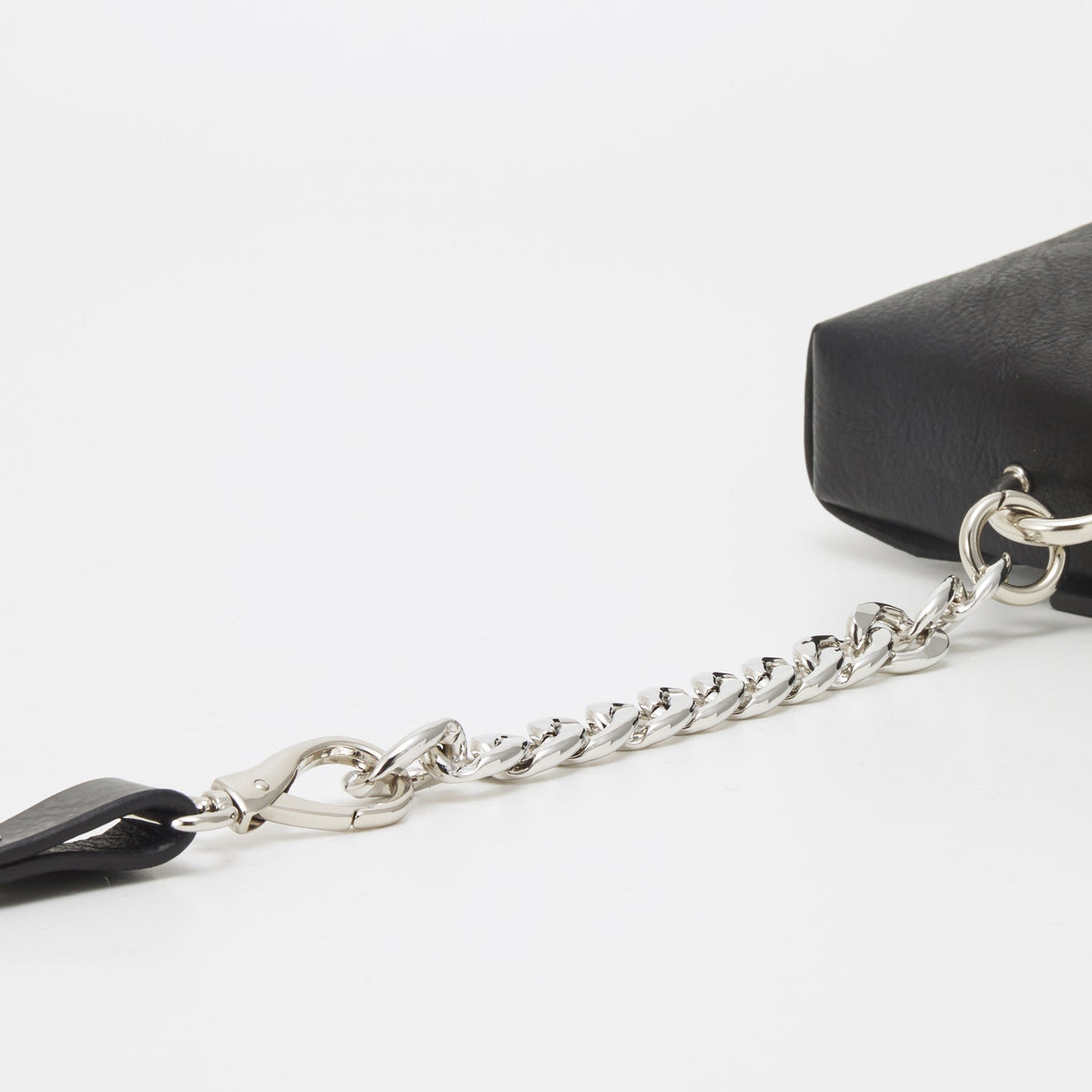 6. Close-up of chain detail on handmade black leather envelope bag by Daz Studio
