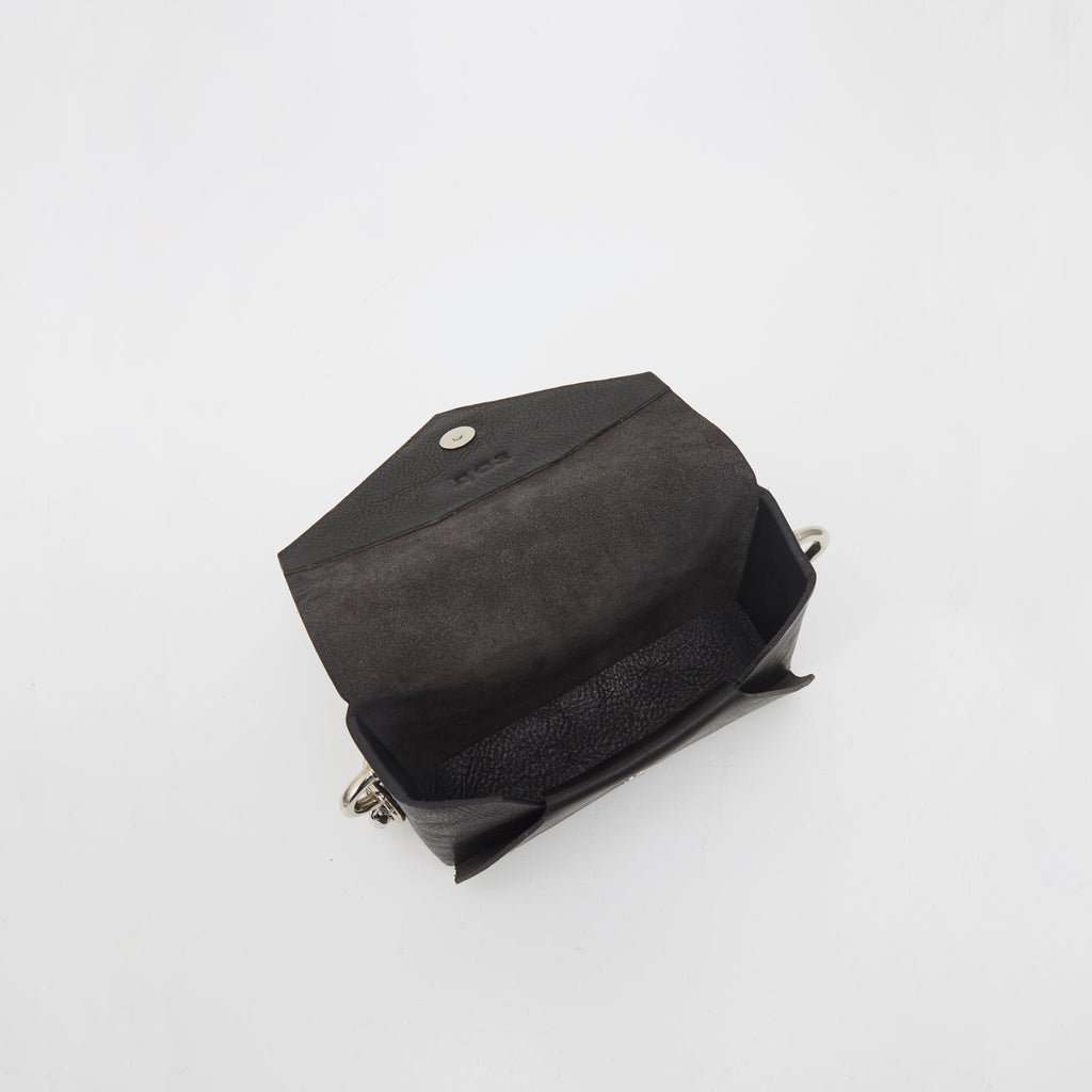 7. Interior view of handmade black leather envelope bag by Daz Studio showing raw leather finish