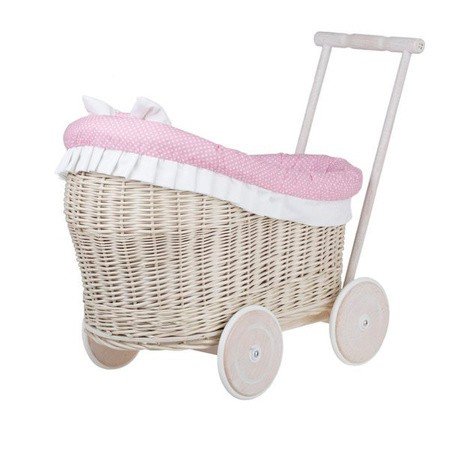 3. Side view of whitewashed wicker doll pram with pink bedding, studio background