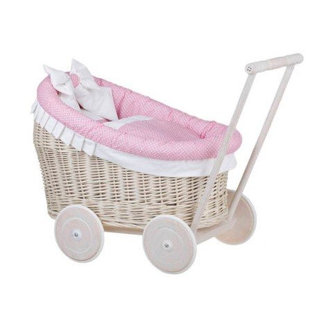 10. Angled view of whitewashed wicker doll pram with pink bedding, studio background