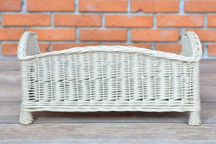 2. Back view of whitewashed wicker pet bed showing woven design