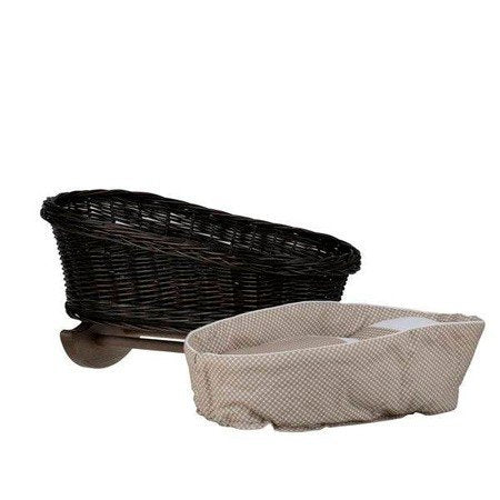 3. Close-up of wicker rocking cradle with removable beige checkered bedding