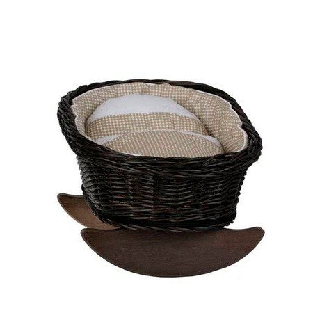 3. Top view of wicker rocking cradle with beige checkered bedding and wooden rockers