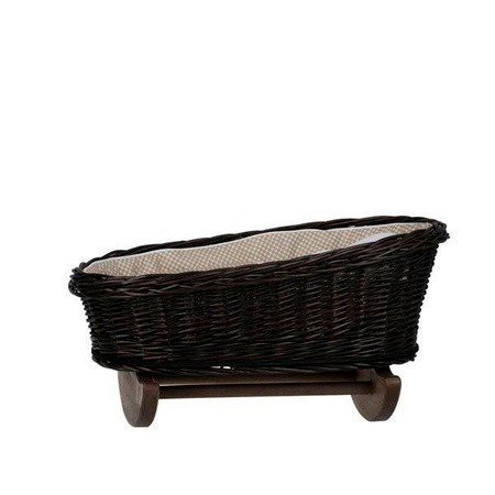 2. Wicker rocking cradle with beige checkered bedding on wooden rockers