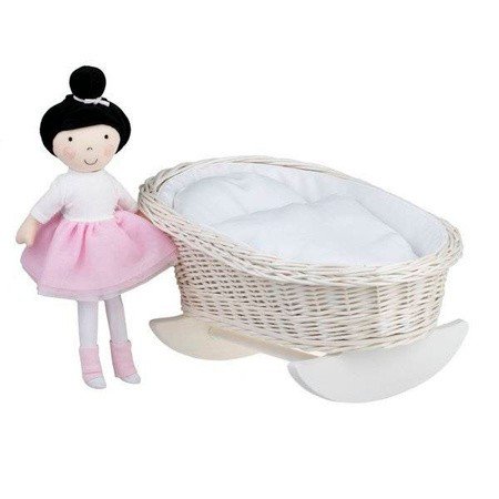 1. Wicker rocking cradle with white bedding next to a doll in a pink skirt, showcasing playroom setting