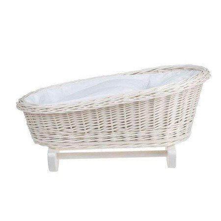 2. Wicker rocking cradle with white bedding shown from side, emphasizing rocking base