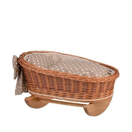 2. Wicker rocking cradle with beige checkered bedding and bow detail on wooden base