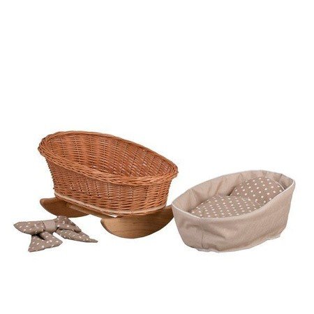 4. Flat lay of wicker rocking cradle with separate beige checkered bedding and bows