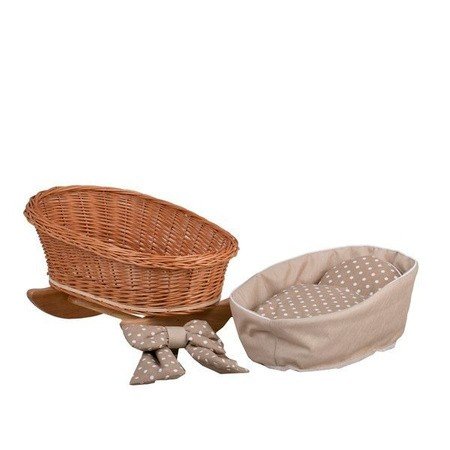 4. Flat lay of wicker rocking cradle with separate beige checkered bedding and bows