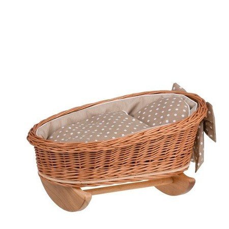 2. Wicker rocking cradle with beige checkered bedding and bow detail on wooden base