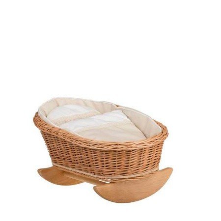 6. Wicker rocking cradle with white bedding shown from side view