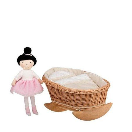 1. Wicker rocking cradle with white bedding and a doll in a pink dress standing beside it