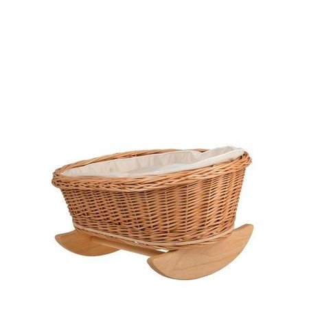 7. Wicker rocking cradle with white bedding on a white background