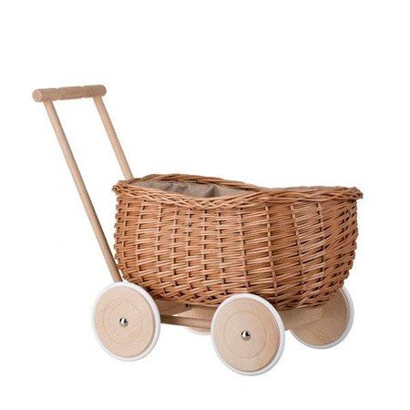 2. Angled view of Wicker Stories toy trailer with wicker basket and wooden wheels