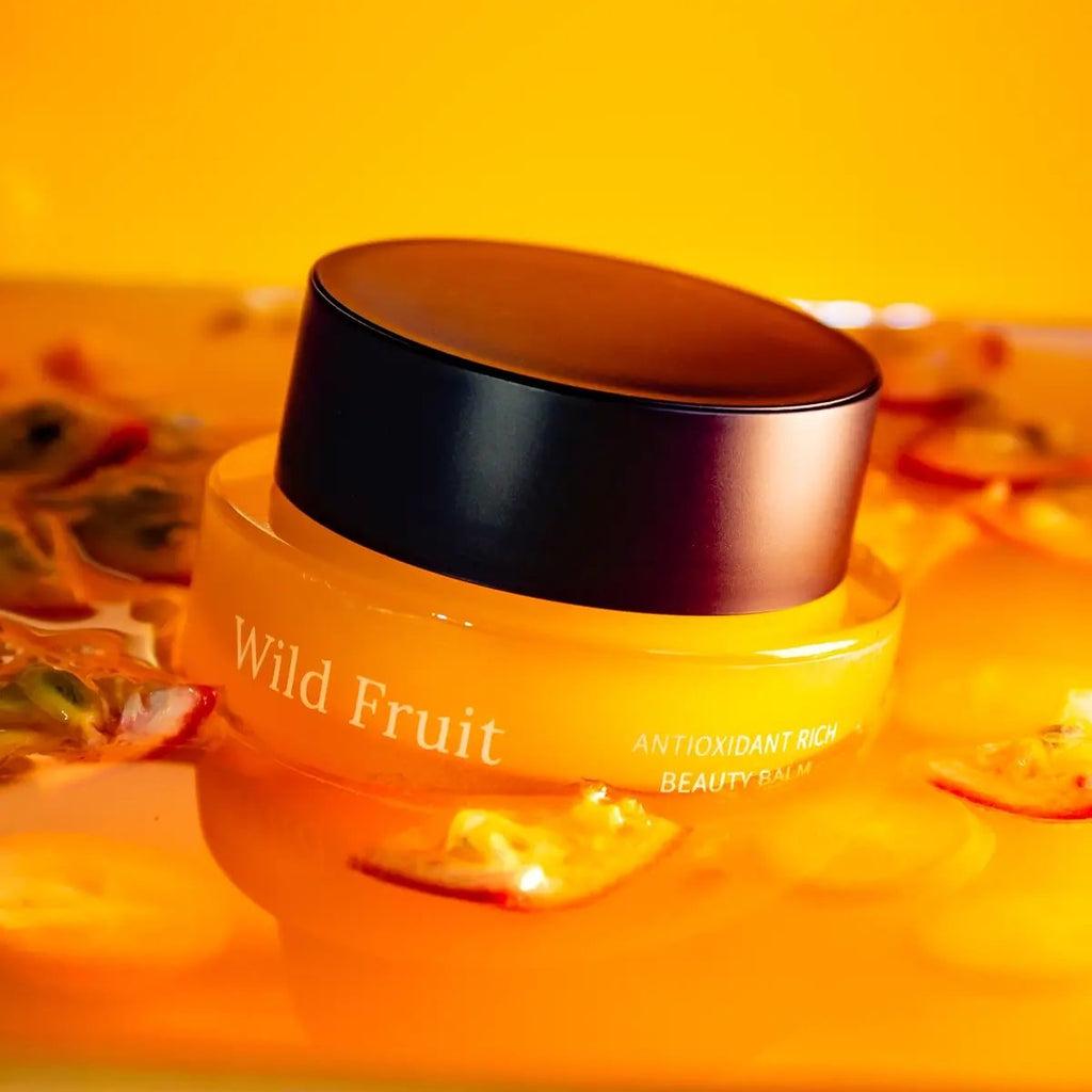 1. Usva Cosmetics Wild Fruit Antioxidant Rich Beauty Balm in vibrant setting with fruit slices