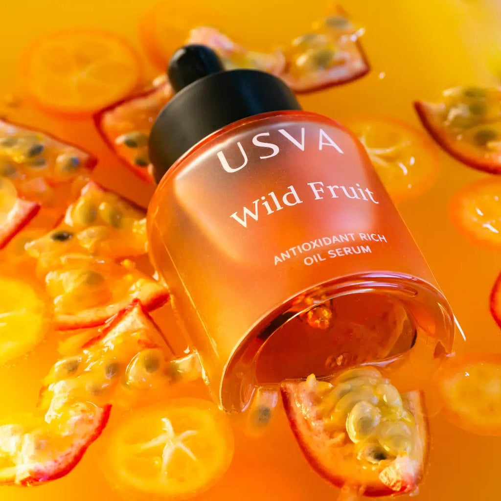 4. Usva Cosmetics Wild Fruit Antioxidant Rich Oil Serum bottle on fruit background, emphasizing natural essence