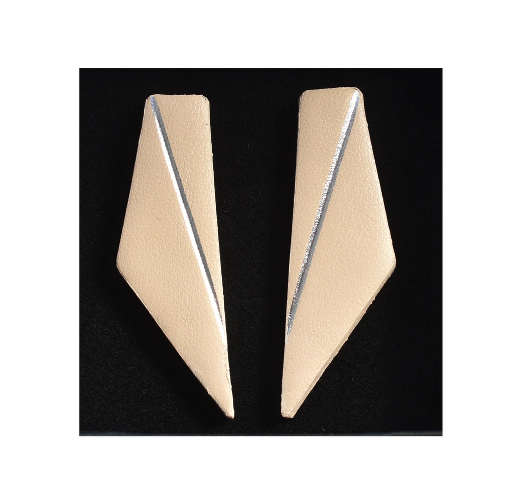 8. Beige Gerda Retter Design Short Wings Earrings on black background, showcasing geometric elegance