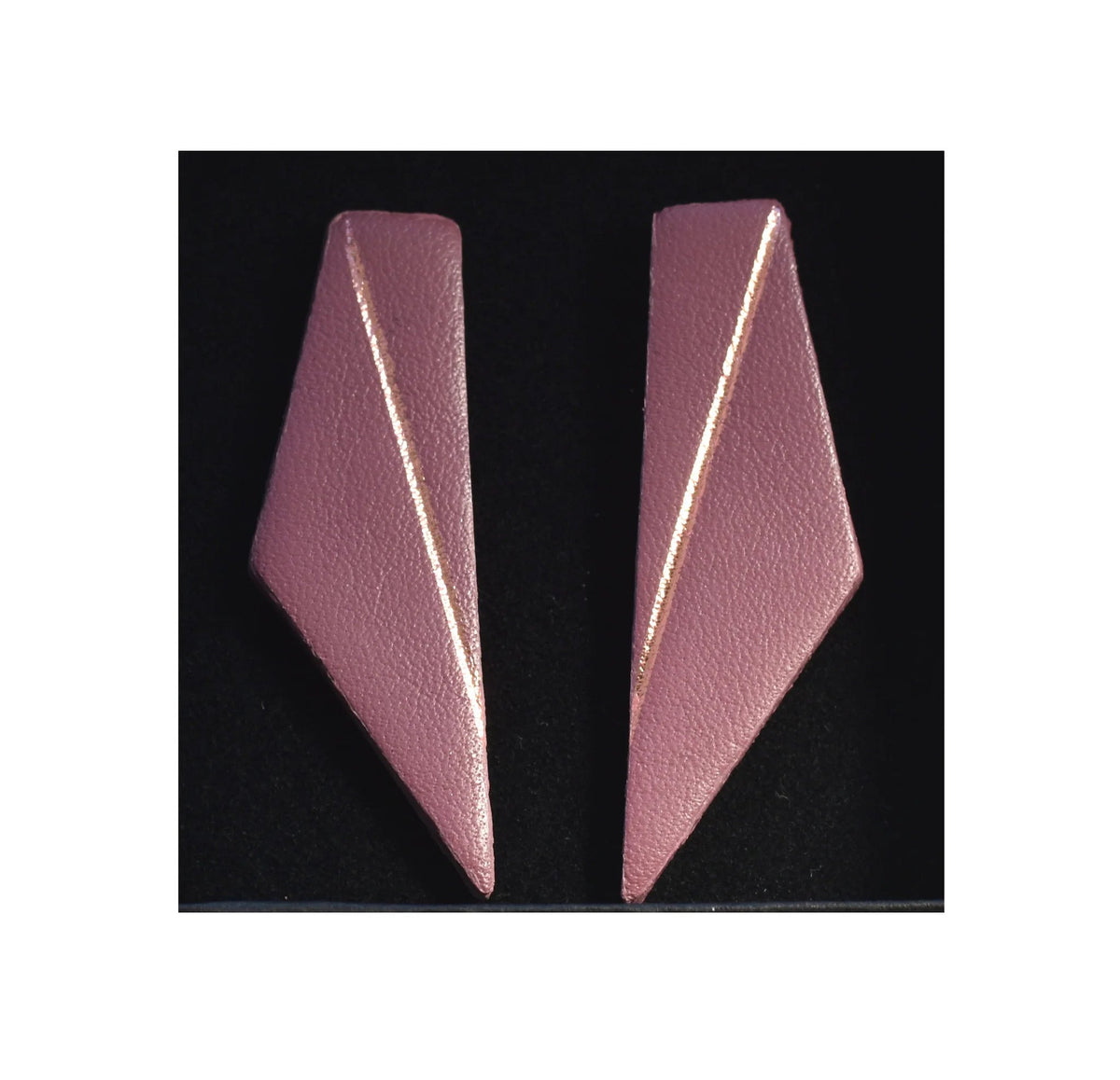 7. Dark dusty pink Gerda Retter Design Short Wings Earrings on black background, highlighting unique shape