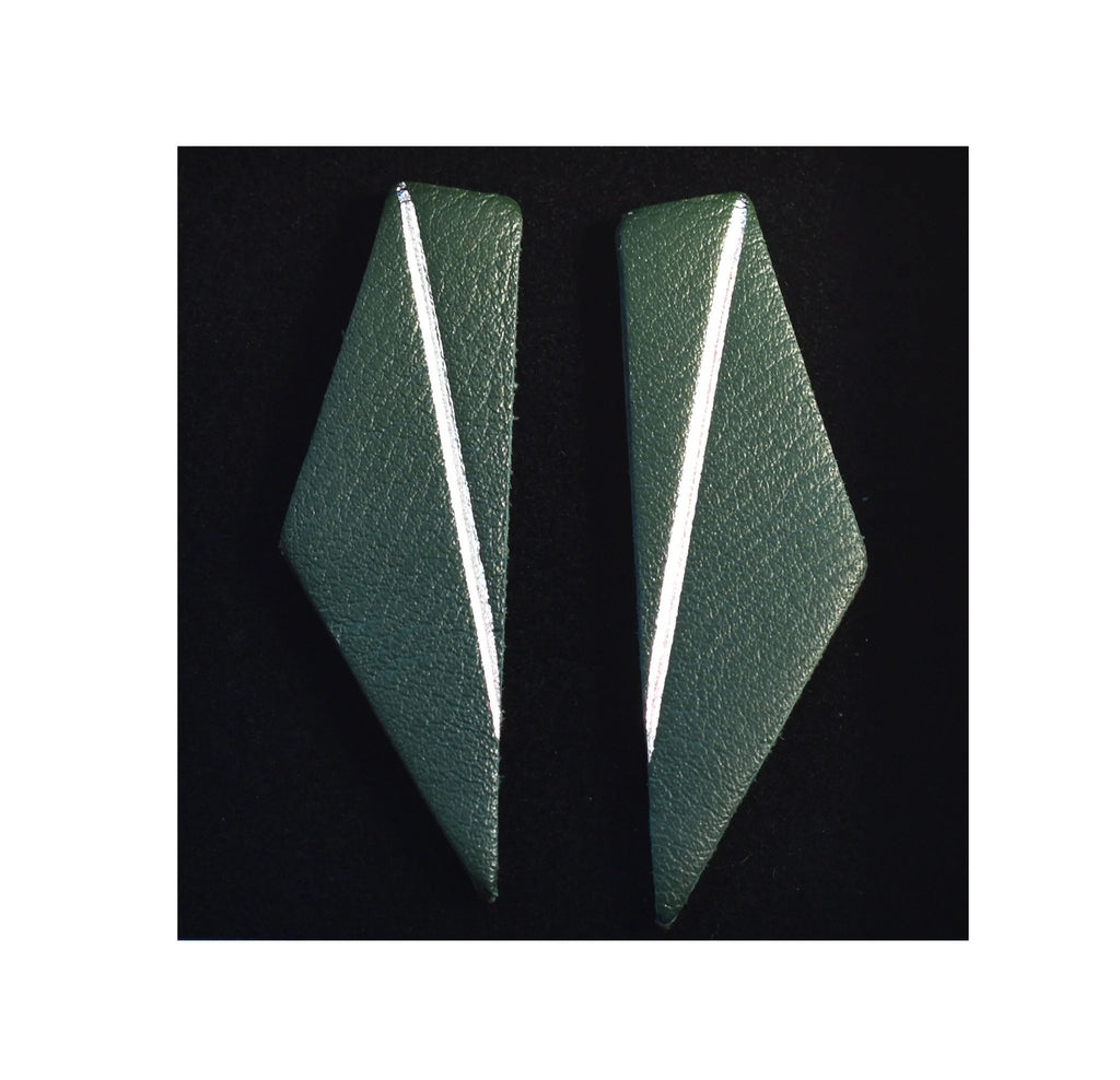 6. Green Gerda Retter Design Short Wings Earrings on black background, emphasizing geometric design