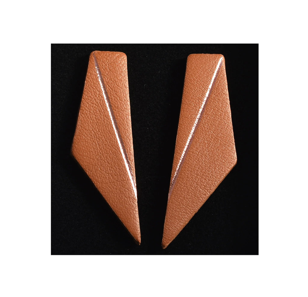 5. Caramel brown Gerda Retter Design Short Wings Earrings on black background, showing geometric style