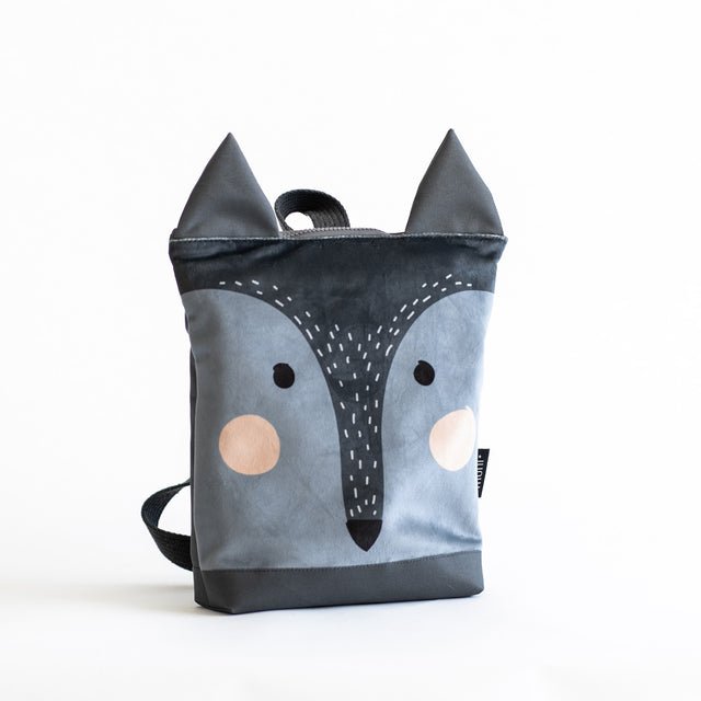 9. Muni kids wolf backpack in studio, angled view highlighting velvet fabric