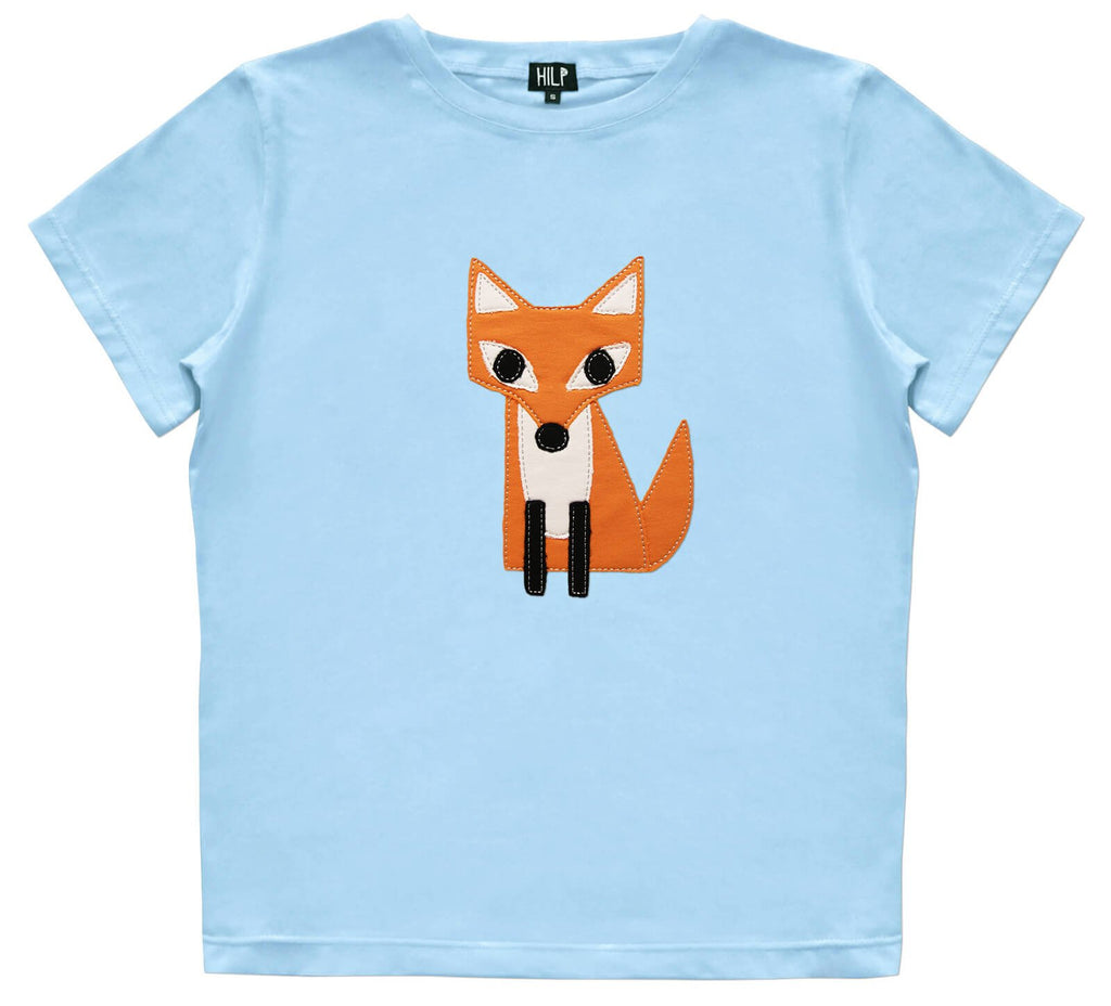 2. Women's light blue HILP Fox T-Shirt with orange fox design, studio setting