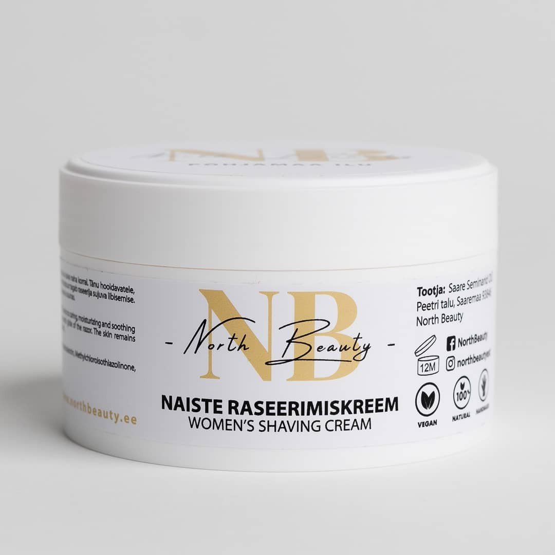 2. North Beauty women's shaving cream in 200ml white jar with gold and black logo, featuring vegan and natural product icons, suitable for sensitive skin, studio background
