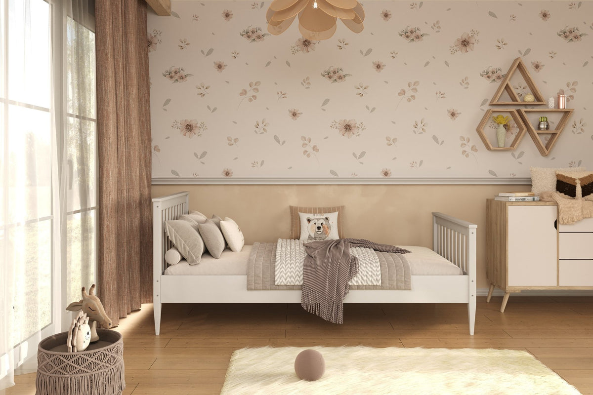 1. White wooden bed in a children's room with floral wallpaper and wooden flooring
