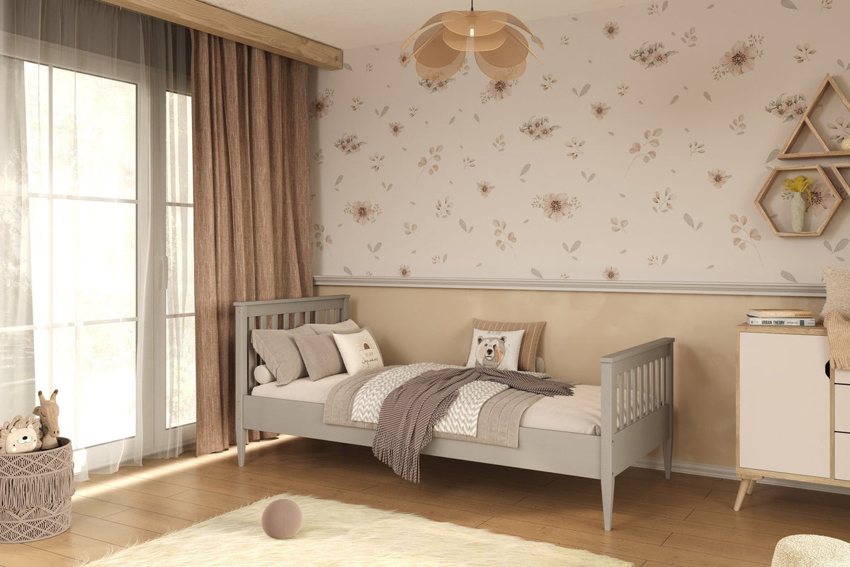 1. Gray wooden bed in a children's room with floral wallpaper and wooden flooring