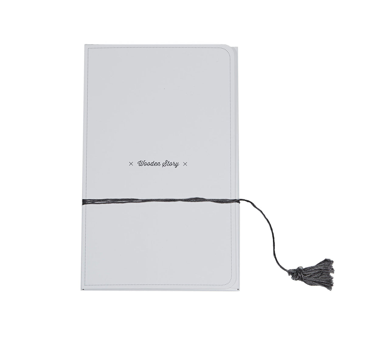 4. Closed packaging of Wooden Story doll with brand name on white cover tied with tassel