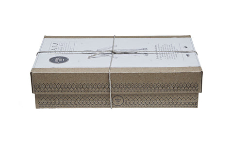 5. Closed cardboard box with Wooden Story branding and string tie