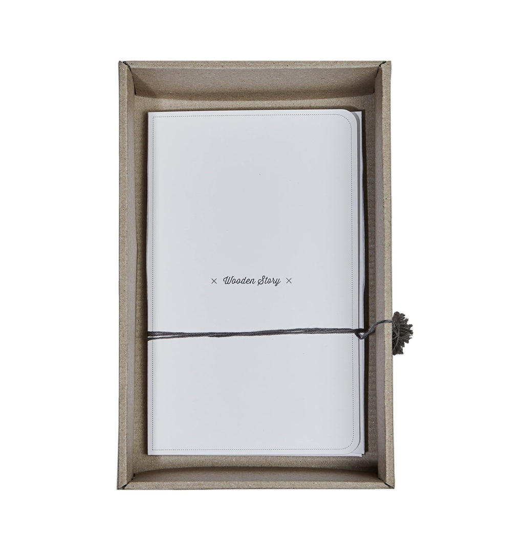 4. Flat lay of Wooden Story packaging box with black tassel