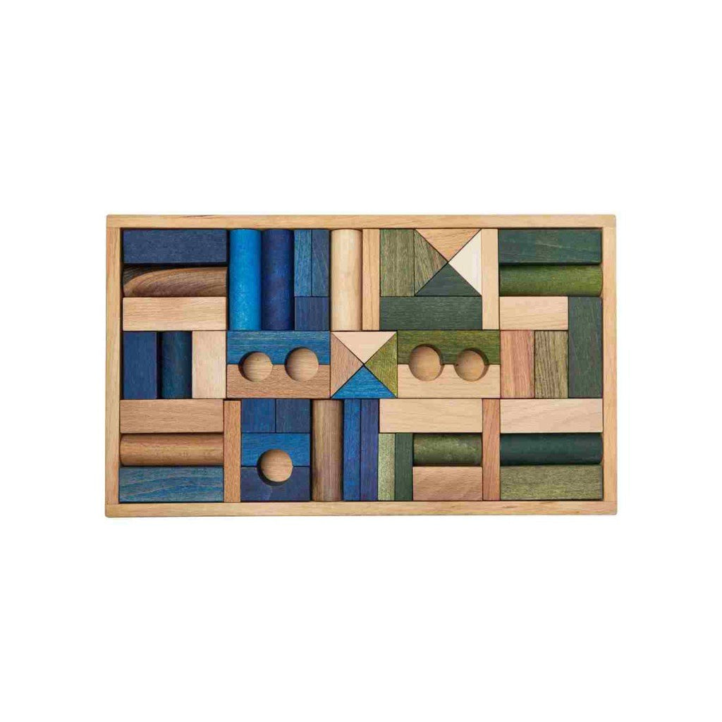 2. Wooden Story wooden blocks in shades of green, blue, and brown arranged in a wooden box