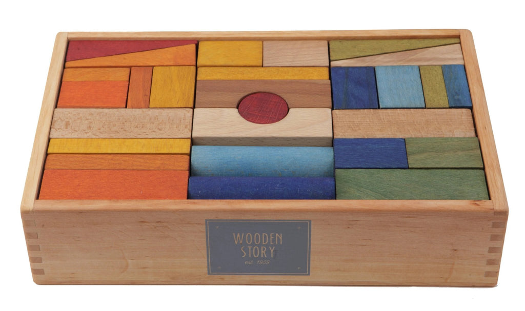 3. Close-up of Wooden Story wooden blocks in a box, showcasing vibrant colors and smooth texture