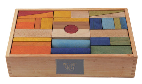 3. Close-up of Wooden Story wooden blocks in a box, showcasing vibrant colors and smooth texture
