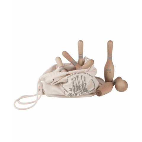 4. Wooden bowling pins and balls partially inside a cotton drawstring bag with printed design