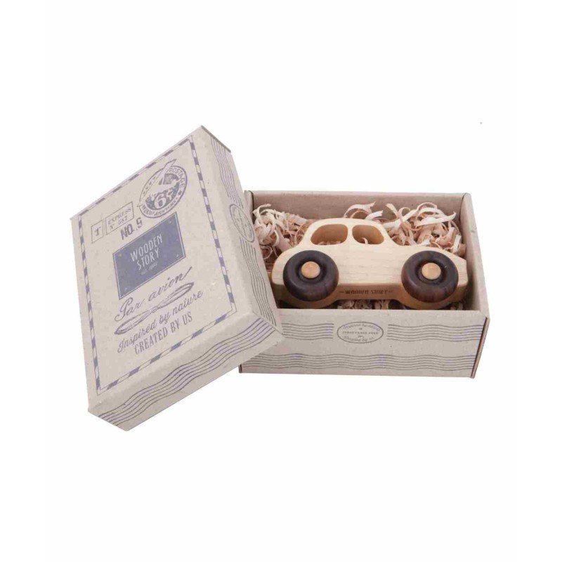 4. Open cardboard box with 1950s Wooden Story car nestled in shredded paper