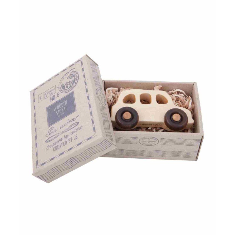2. Wooden Story English taxi toy car in open cardboard box with vintage design and natural wood shavings