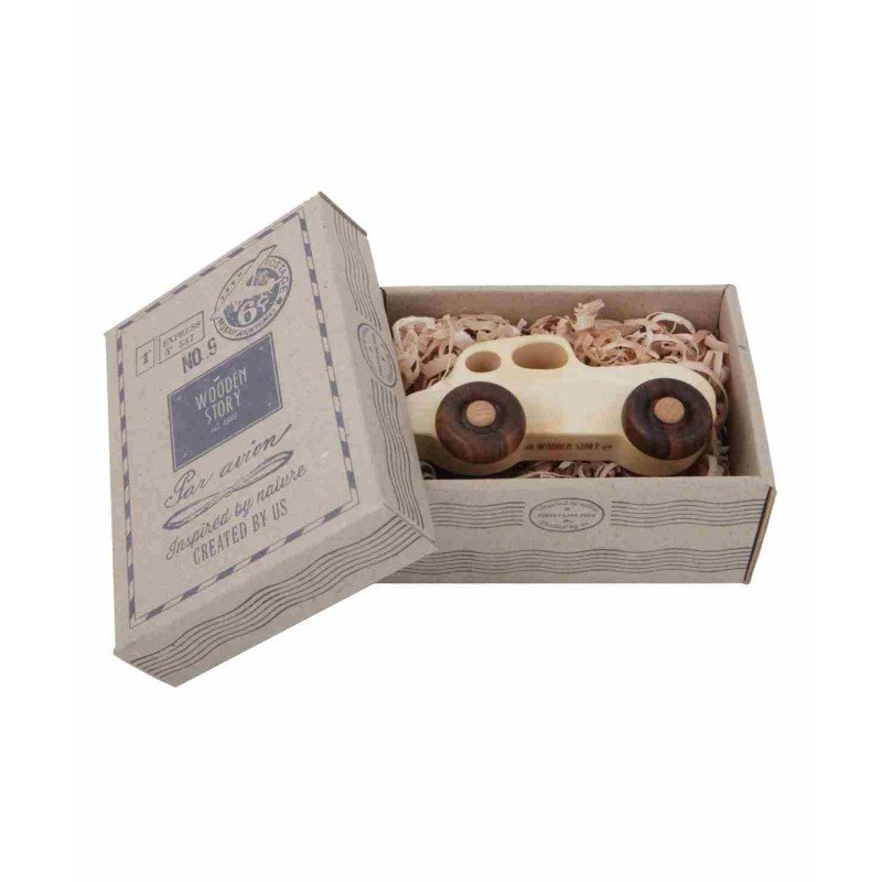 4. Wooden Story retro toy car in open cardboard box with shredded paper packaging