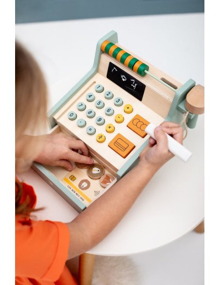 5. Child playing with wooden cash register, pressing buttons and using card
