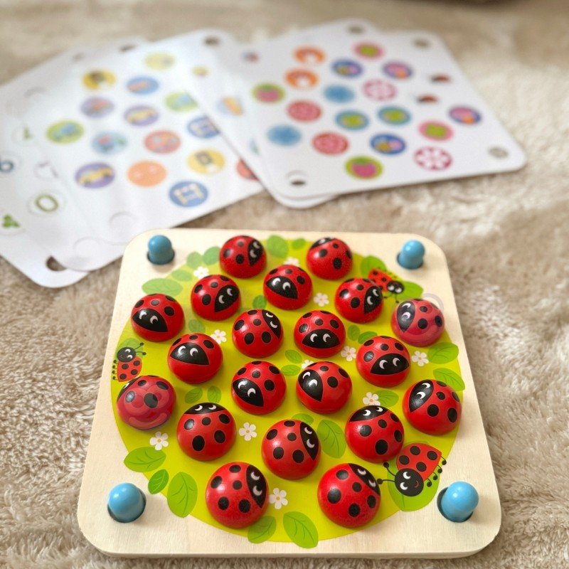 3. Close-up of Woopie Let's Go Green ladybug memory puzzle with colorful motif cards