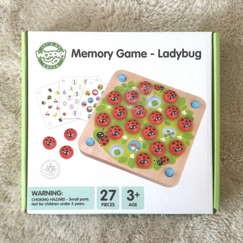 2. Packaging of Woopie Let's Go Green ladybug memory game showing 27 pieces and age 3+