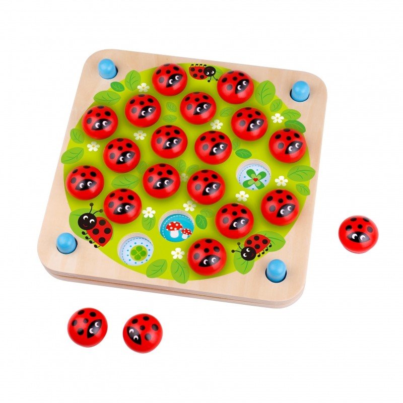 8. Studio shot of Woopie Let's Go Green ladybug memory puzzle with ladybug pieces on a green board